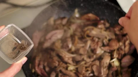 The Complete Cooking Process with Various Spices and Meat in a Pan for a Stock Footage 301633448