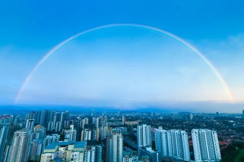 A complete double rainbow arch over Kuala Lumpur city Stock Photos