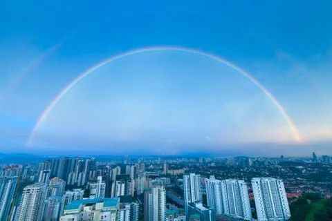 A complete double rainbow arch over Kuala Lumpur city Stock Photos