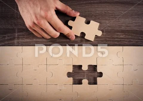Complete a puzzle Stock Photos
