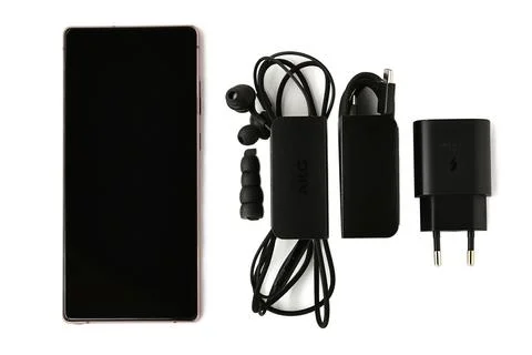 Complete set a wired headset silicone headphones a USB cable a power supply Stock Photos