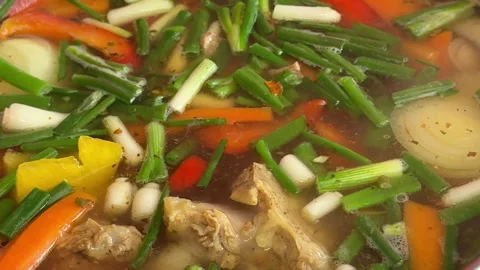 Complete shurpa soup cooking process goat meat vegetables herbs and traditional Stock Footage 345722895