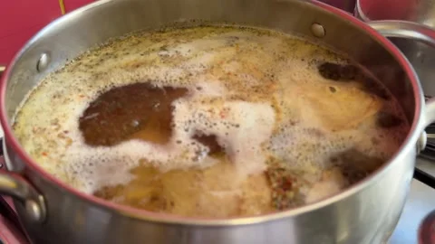 Complete shurpa soup cooking process goat meat vegetables herbs and traditional Stock Footage 345728428