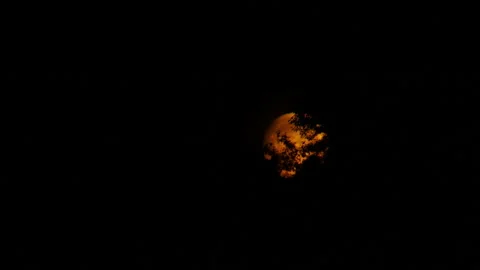 Complete view of the moon. Full moon observed through binoculars. Nighttime Stock Footage 280560032