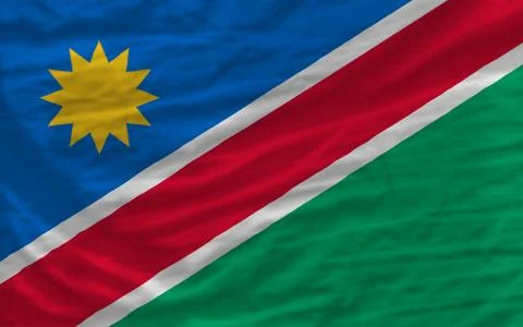 Complete waved national flag of namibia for background Stock Photos