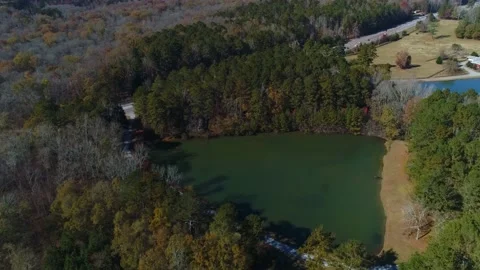 Completed aerial drone view of triangle lake surround by trees forest Stock Footage 170457432