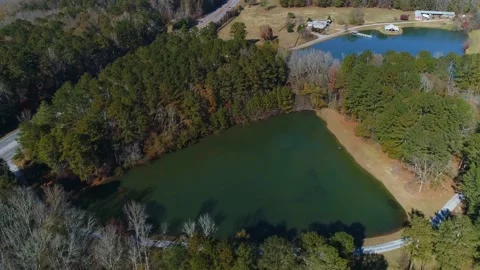 Completed aerial drone view of triangle lake surround by trees Stock Footage 170457521