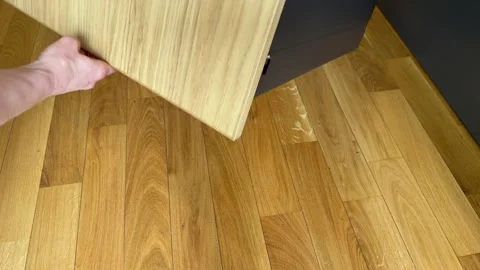 Completed drawer with wooden front panel being lifted and removed from frame Stock Footage 333788880