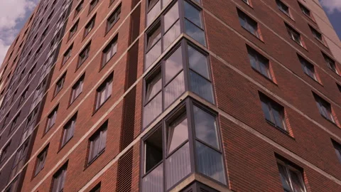 Completed glazing on modern brick residential building facade Stock-Footage 343449941