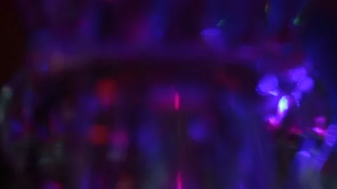 On a completely blurred background, the transfusion of multi-colored rays Stock Footage 143843018