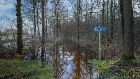 Completely flooded cycle path after weeks of heavy rainfall due to climate .. Stock-Fotos