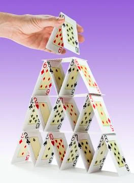 Completing a house of cards Stock Photos