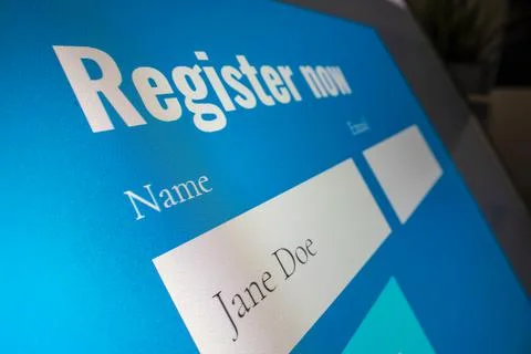 Completing registration form online Stock Photos