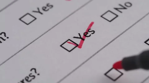 Completing a survey form with a marker in focus Stock Footage 328134358