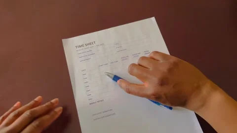 Completing a time sheet Stock-Footage 183192999