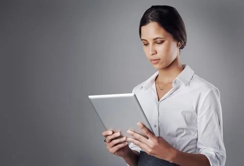 Completing work tasks on the spot with wireless technology. Studio shot of a Stock Photos