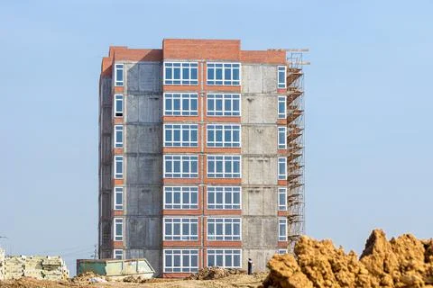 Completion of the construction of a residential building, installation of window Stock Photos