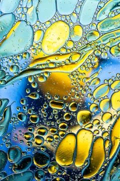 Complex abstract pattern of colorful oil drops and fluid lines macro shot Stock Photos