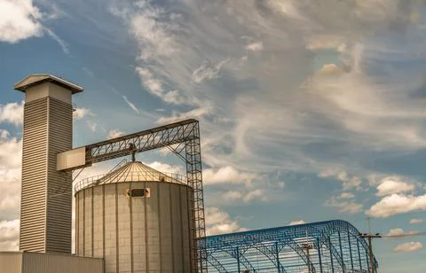 The complex agricultural silo installations for the storage of grain on blue Stock Photos