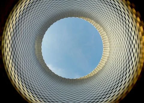 Complex architecture, reflective, undulating organic forms. Stock Photos