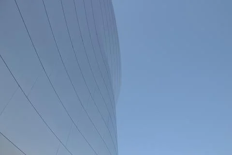 Complex architecture, reflective, undulating organic forms. Stock Photos