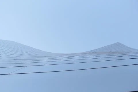 Complex architecture, reflective, undulating organic forms. Stock Photos