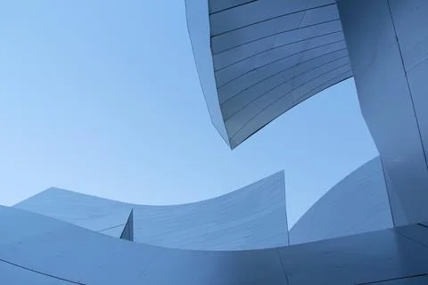 Complex architecture, reflective, undulating organic forms. Stock Photos