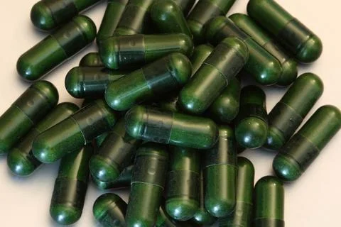 Complex-B capsules lie on a flat surface Foto stock