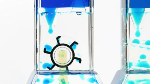 Complex blue fluid hourglass machine, fast turning wheel, flow, movement time Stock Footage 169759224