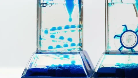 Complex blue fluid hourglass machine, time flow concept, liquid falling Stock Footage 169759471
