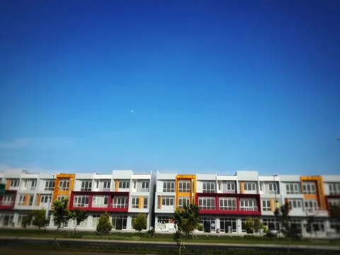 A complex of buildings with blue sky background Foto stock