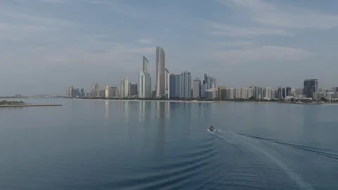 Complex Drone Forward-Dive with Camera Tilt-Up on Cityscape and Boat Stock Footage 335463716