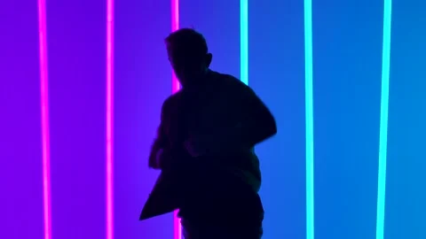 Complex elements of break dance performed by a professional dancer in a dark Stock Footage 144418594