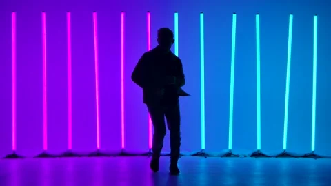 Complex elements of break dance performed by a professional dancer in a dark Stock Footage 144420514