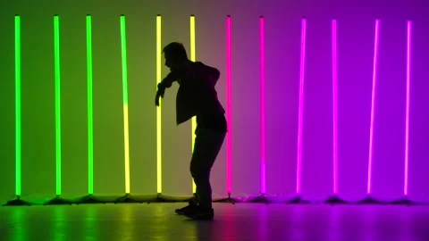 Complex elements of break dance performed by a professional dancer in a dark Stock Footage 144420646