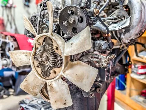 Complex engine work in auto shop Stock Photos