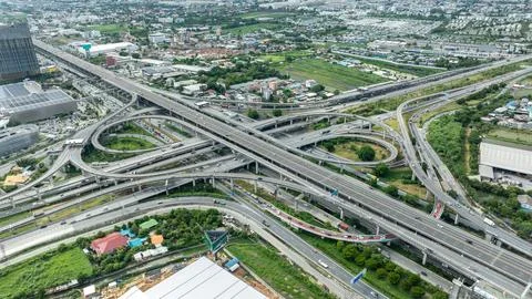 Complex Highway Interchange With Multilevel Overpasses And Traffic Flow In .. Stock Photos