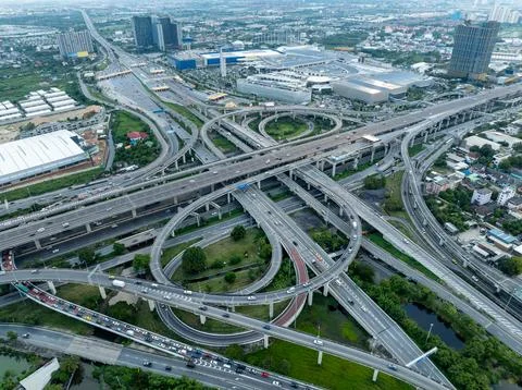 Complex Highway Interchange Weaving Through A Modern Metropolis Aerial View Stock Photos