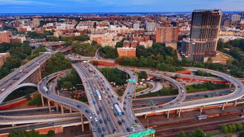 Complex interchange with lively traffic. Multiple cars move by the roads and Stock Footage 337715138