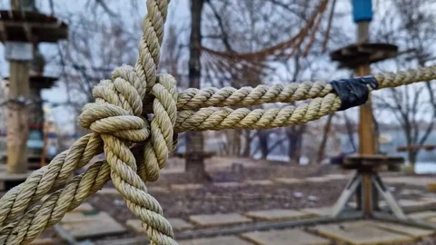 A complex knot of thick ropes, which is part of the structure of a rope park Stock Footage 331156016