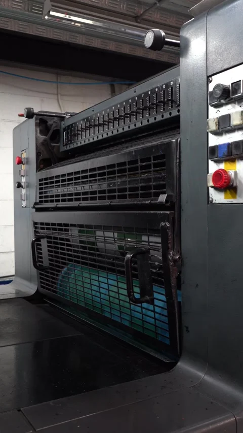 Complex Machinery in Motion: Industrial Printing Press in Operation Stock Footage 325359198