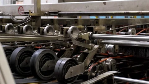 Complex Mechanical Assembly with Rubber Wheels on Industrial Packaging Prod.. Видео 337670282