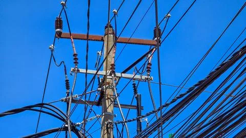 Complex Mess of Electrical Power Lines and Utility Pole Stock Photos