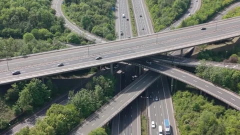 Complex Motorway Junction With Traffic Flowing on a Sunny Day Stock Footage 336953733