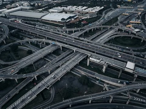 Complex Multi-level Highway Interchange With Flowing Vehicle Traffic In Lar.. Photos