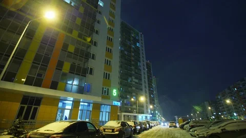 Complex with multi-storey buildings at cold winter night Stock Footage 125312247
