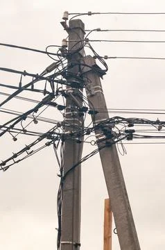 Complex Network of Electrical Wires and Utility Poles Stock Photos