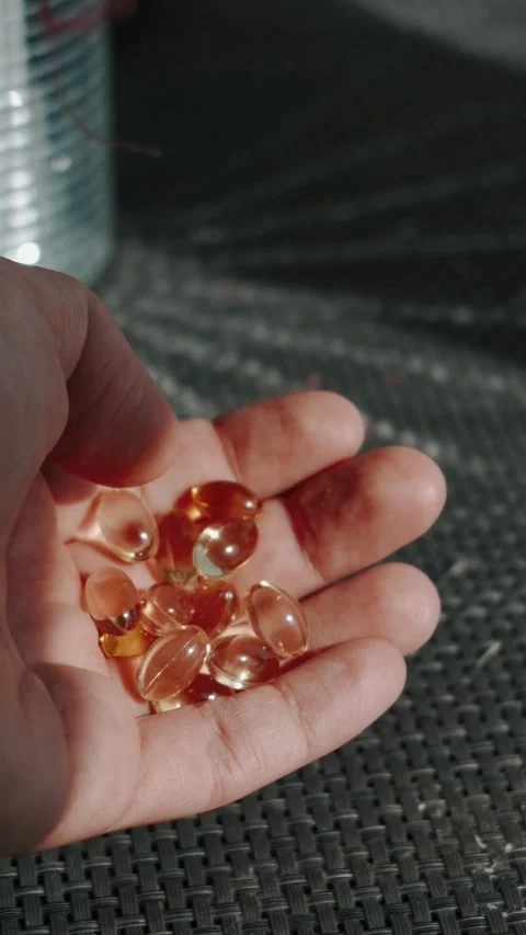 A complex of omega-3 vitamins and dietary supplements for health and nutrition Vídeos de archivo 330429927