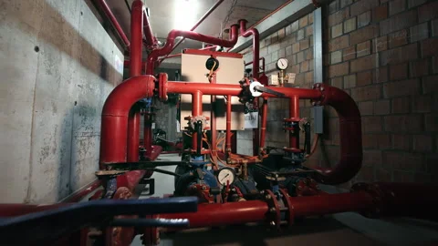 Complex Piping System in an Industrial Boiler Room Stock Footage 258588664