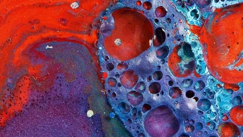 Complex purple and red and blue vibrant bright paint and oil color swirls Stock Footage 81609369